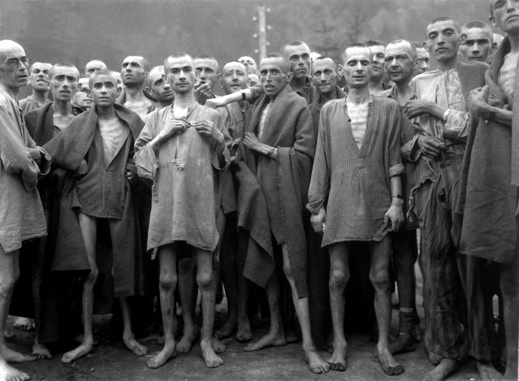 Starved prisoners, nearly dead from hunger, pose in concentration camp in Ebensee, Austria.  The camp was reputedly used for "scientific" experiments.  It was liberated by the 80th Division.  May 7, 1945.  Lt. A. E. Samuelson.  (Army) NARA FILE #:  111-SC-204480 WAR & CONFLICT BOOK #:  1103